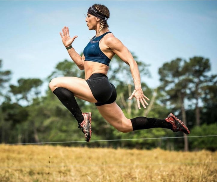 Renee Pickett doing some sort of split jump