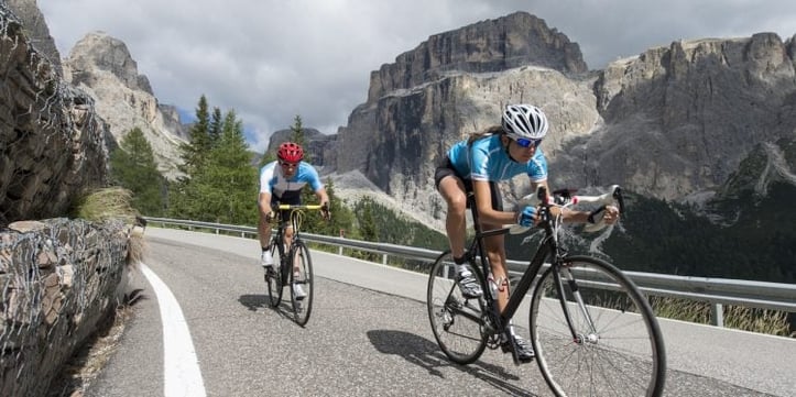 cyclists biking on a road