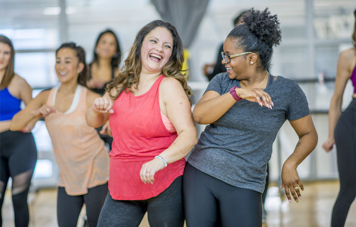 A group of women dancing in a studio