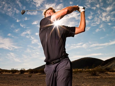 golfer swinging club