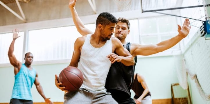 two men playing basketball