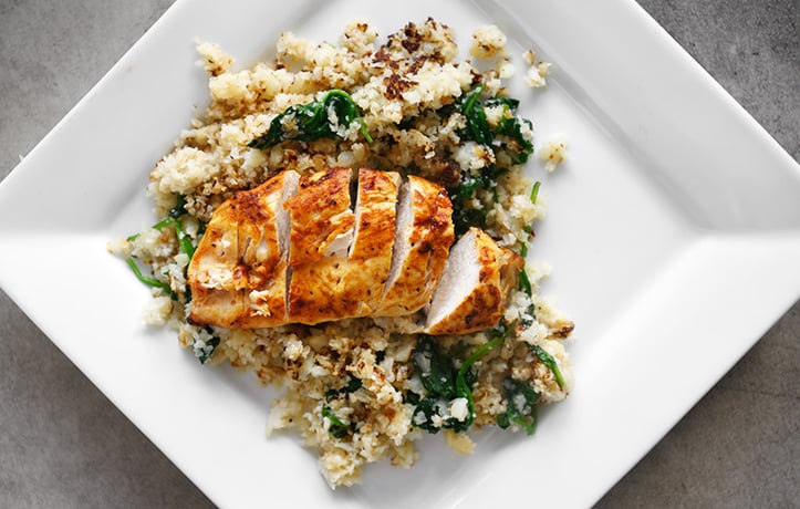 chicken and rice on a white plate