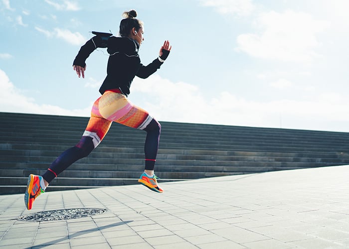 power athlete sprinting outside