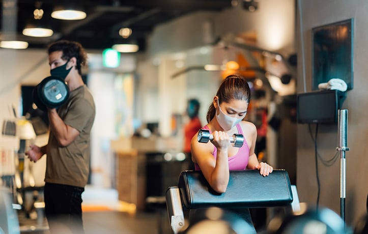 two fitness enthusiasts working out after covid